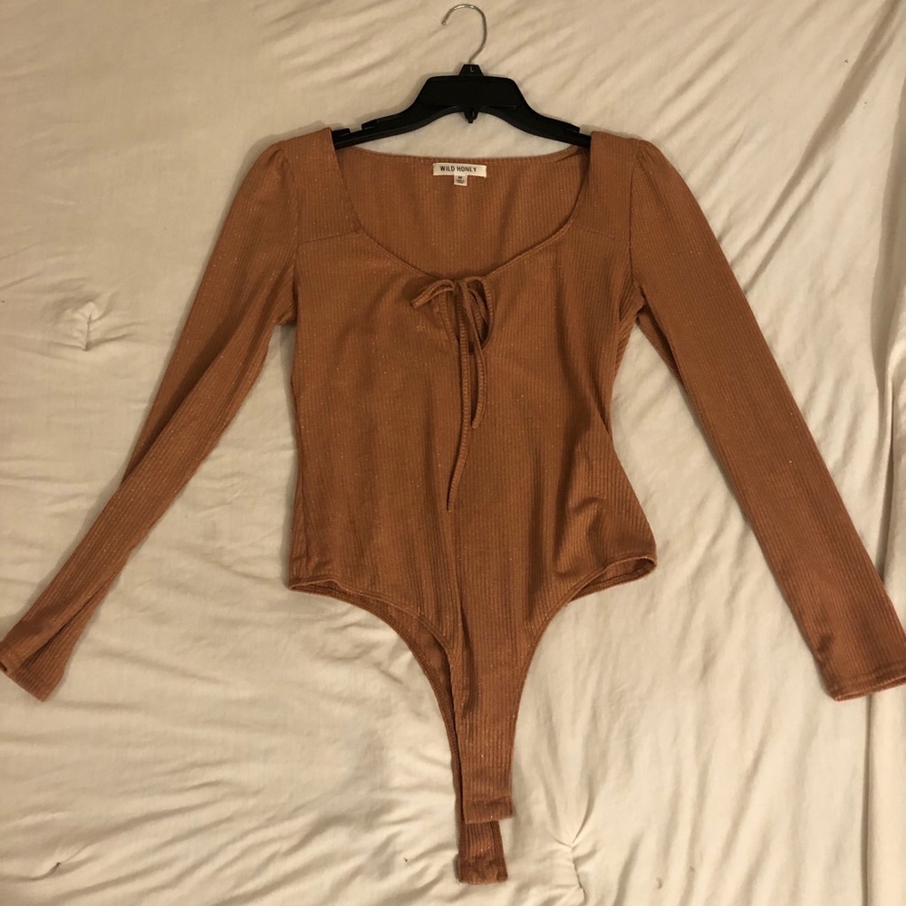 Tan sparkly body suit